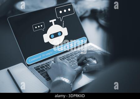 Close up of hands typing on laptop keyboard with AI chatbot icon and command prompt on screen, providing smart virtual assistant and customer support Stock Photo
