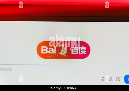 Close up of a computer screen displaying the Baidu logo and search interface with Chinese characters, representing Chinese internet technology, web se Stock Photo