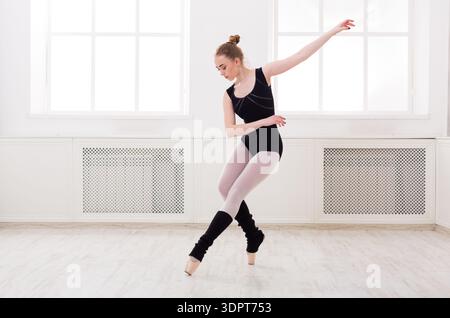 Ballet Dancer Practices in Studio During Daytime Stock Photo