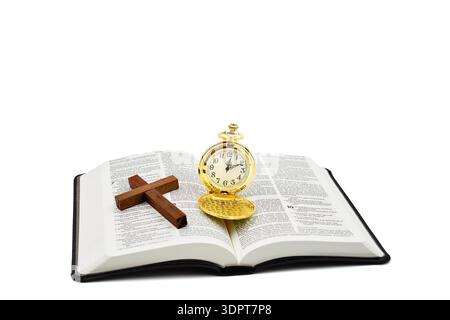 Pocket watch and cross on a open Holy Bible with a white background. Copy space above. Stock Photo