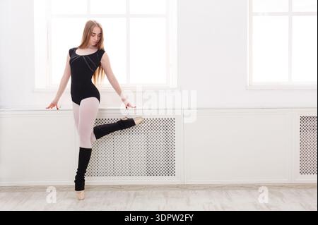 Young Ballet Dancer Practicing in a Studio With Large Windows During Daytime Stock Photo