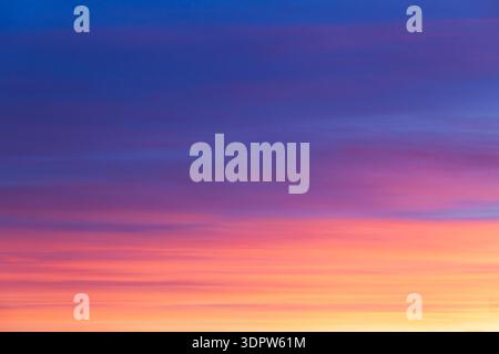 Amazing pink sunset sky with blue background. No people or any distractions Stock Photo