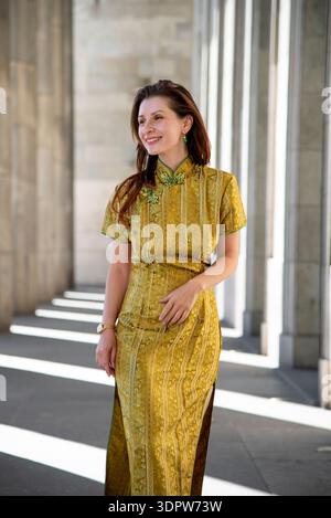 Beautiful Chinese woman wearing a traditional dress known as a Cheongsam or  Chipao isolated on a white background Stock Photo - Alamy