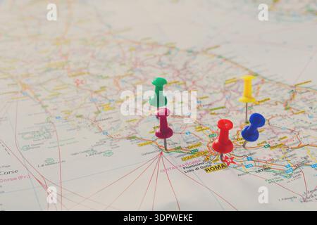 Colored Pins Are Placed on a Detailed Map of Italy Showing Various Locations Stock Photo