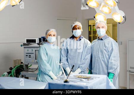 Group of doctors discussing patient cases around table. Stock Photo