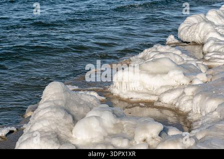 Icy winter seascape with small icebergs and frozen waves on the Baltic Sea Stock Photo