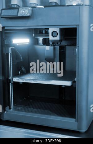 3D printer. 3D printer with a blank build surface. Open 3D printer. 3D printer with an empty work surface. Concept printing technology. Additive progressive FDM technologies Stock Photo