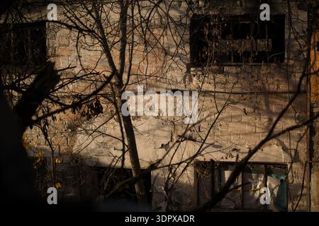 Abandoned House Wall with Broken Windows at Sunset Stock Photo