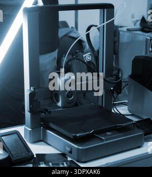 3D printer. 3D printer with a blank build surface. Open 3D printer. 3D printer with an empty work surface. Concept printing technology. Additive progressive FDM technologies Stock Photo