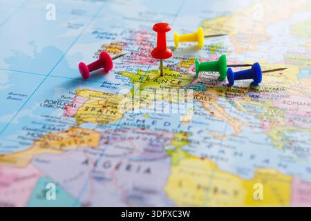 Colorful Pins Mark Locations on a Map of Europe With France Highlighted Prominently Stock Photo