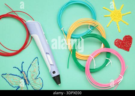 3d handle pen and 3d painting figures on mint background Stock Photo