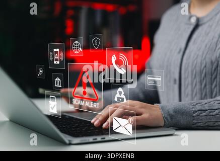 Scam alert warning. cybersecurity concept. Woman using laptop, warning sign for scams with icons representing online threats, phishing, Stock Photo
