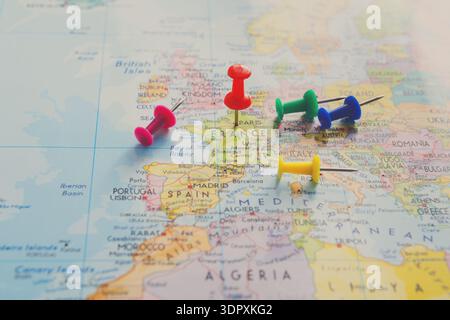 Map of Europe Marked With Colorful Push Pins Near France, Spain, and Other Countries Stock Photo