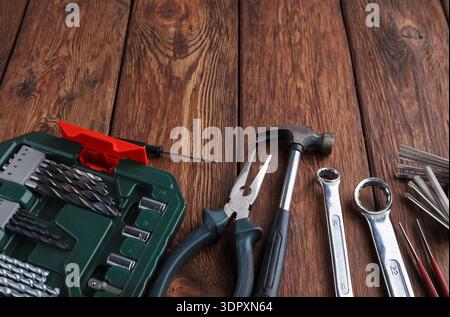 Tools and Equipment Arranged on Wooden Surface for DIY Projects and Repairs in Home Workshop Stock Photo