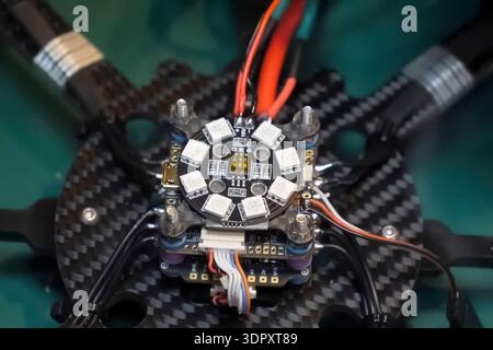 Soldering the power wires to the drone controller board Stock Photo