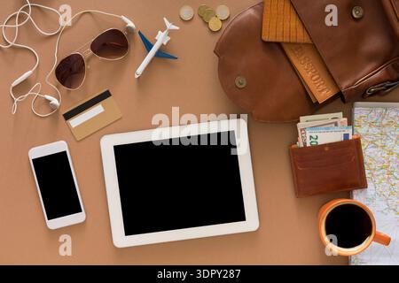 Travel Essentials Laid out on the Table for a Journey to a New Destination Stock Photo