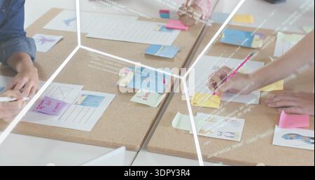 Writing hands sorting sticky notes, layouts on cork boards at office using pink pencil denim sleeve Stock Photo