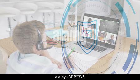 Using laptop, kid in striped shirt sitting at home table with over-ear headset mic, shield overlay Stock Photo