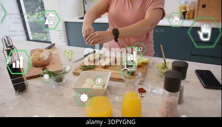 Sprinkling woman in pink t-shirt seasoning avocado toast on marble island, with AR overlays Stock Photo