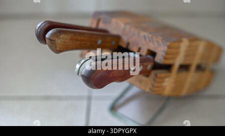 kitchen knives in wooden holder. Close up Stock Photo