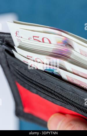 Close up of a wallet full of £50 notes Stock Photo