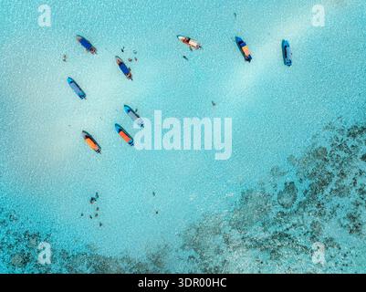 Aerial view of boats and yachts in sea with clear turquoise water Stock Photo