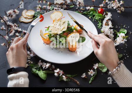 Fresh Salad Served With Shrimp and Garnished With Flowers in a Casual Dining Setting Stock Photo