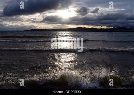 Sunlight breaking through cloud over Lake Taupō, Taupō, North Island, New Zealand. Stock Photo