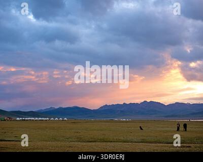 Sunset over yurts on the shores of Son Kul lake Stock Photo