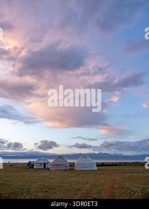 Sunset over yurts on the shores of Son Kul lake Stock Photo