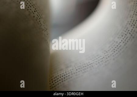 Details of phrases in books, the Bible, and the Word. Image of a sheet of paper with a focus on phrases. Blurred background, aged paper leaves. Stock Photo