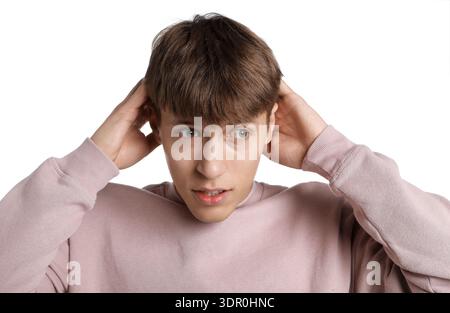 Amnesia. Thoughtful man trying to remember something on white background Stock Photo