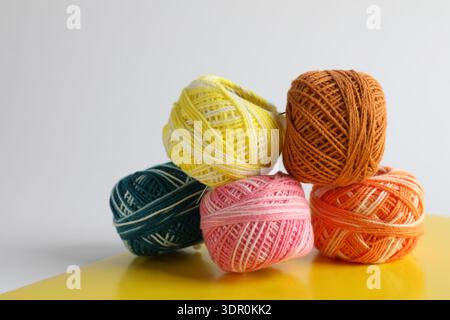 Many different spools of thread on light grey background, closeup Stock Photo