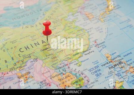 Red Pin Marks Location in China on a Colorful Map Showing Major Regions and Cities Stock Photo
