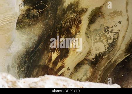Prehistoric cave painting at Leang-leang, Sulawesi, Indonesia, ancient rock art depicting animal pig figure on limestone wall, one of oldest known art Stock Photo