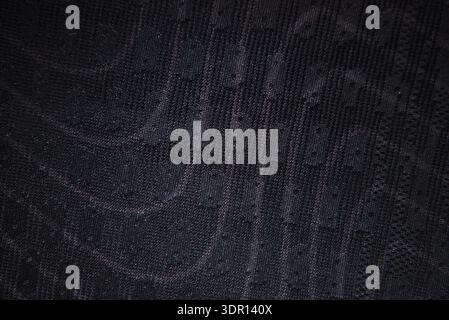Black technical sports fabric texture macro detail breathable knit pattern high quality textile background for activewear and athletic clothing design Stock Photo