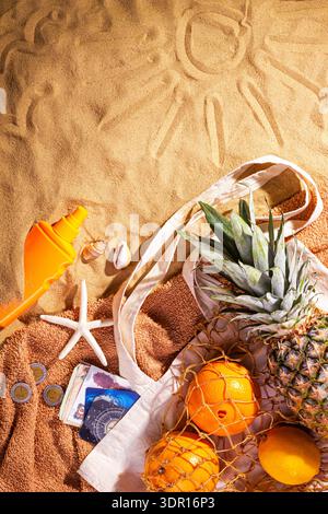 Egypt beach holiday concept with souvenirs and accessories. Beach sand background with copy space for text, top view, flat lay Stock Photo