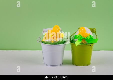 Easter decor with selective focus. Holiday still life with decorative eggs in a buckets with copy space for text Stock Photo