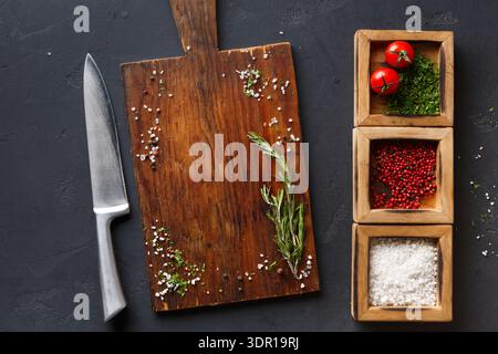 Preparing Ingredients on a Wooden Cutting Board With Spices and Fresh Vegetables in the Kitchen Stock Photo