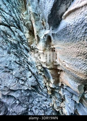 Close-up detail of natural marble stone surface showing intricate mineral veining, subtle tonal variations, and irregular crystalline structure. Stock Photo
