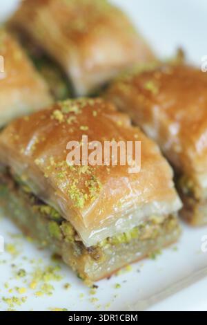 Baklava pieces served on a white plate ready to eat Stock Photo