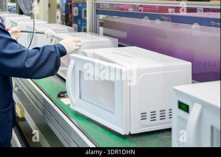 Cll Quality Lab A laboratory technician conducts quality-control testing at the Leefood ...