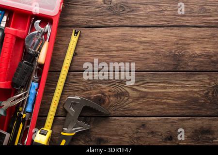 Toolbox With Various Hand Tools on a Wooden Workbench During Daylight Hours Stock Photo