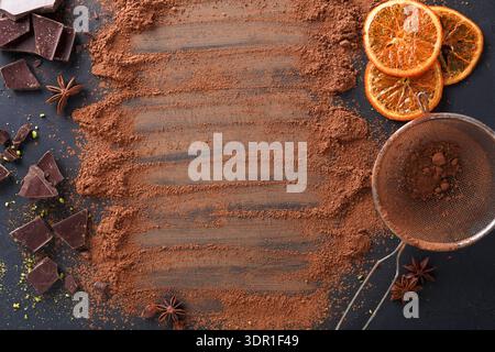 Chocolate and Cocoa Dust With Sliced Oranges on a Dark Surface in a Kitchen Setting Stock Photo