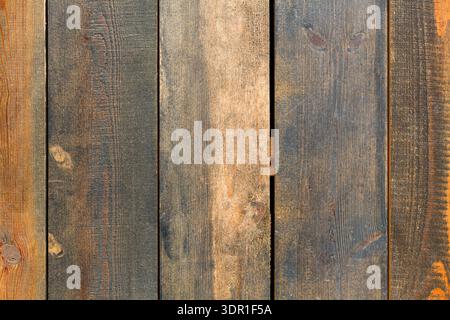 Wood Planks Arranged in a Vertical Pattern Showing Different Colors and Textures in Natural Light Stock Photo