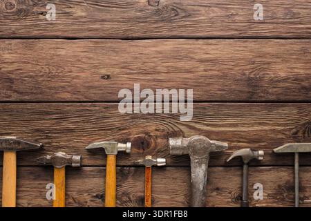 Various Tools Arranged Neatly on a Wooden Surface for Craftsmanship and Repair Work Stock Photo
