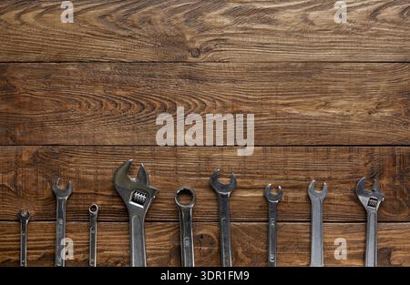 Various Tools Arranged on a Wooden Surface for Maintenance or Repair Work Stock Photo
