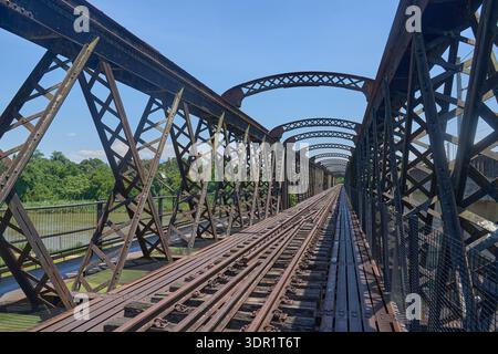 Old Railway Track on Historic Steel Truss Bridge Over Perak River in Enggor, Kuala Kangsar, Perak, Malaysia Stock Photo