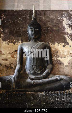 Bangkok, Thailand. February 20th 2025. A black Buddha statue on display in the The Wat Suthat Thepwararam Temple Stock Photo