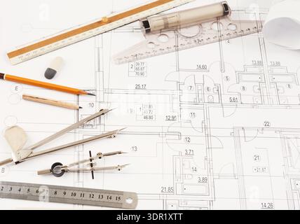 Detailed Collage of Architectural Tools and Building Plans Placed on a Work Surface Stock Photo